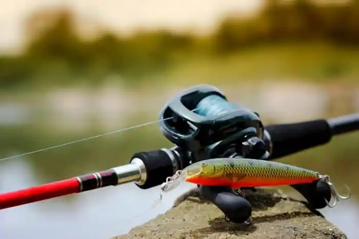 angler using best baitcasting reel on a lake